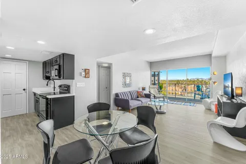a living room with fireplace furniture and a flat screen tv