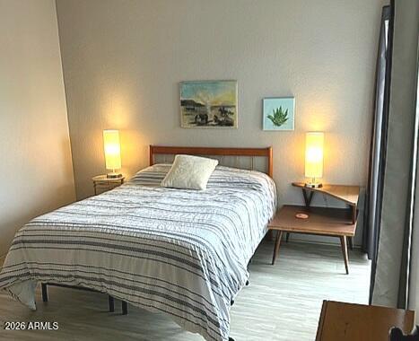 805 North 4th Avenue, Unit 609 Phoenix, AZ 85003 - Photo 17 of 34 a bedroom with a bed and a lamp on dresser