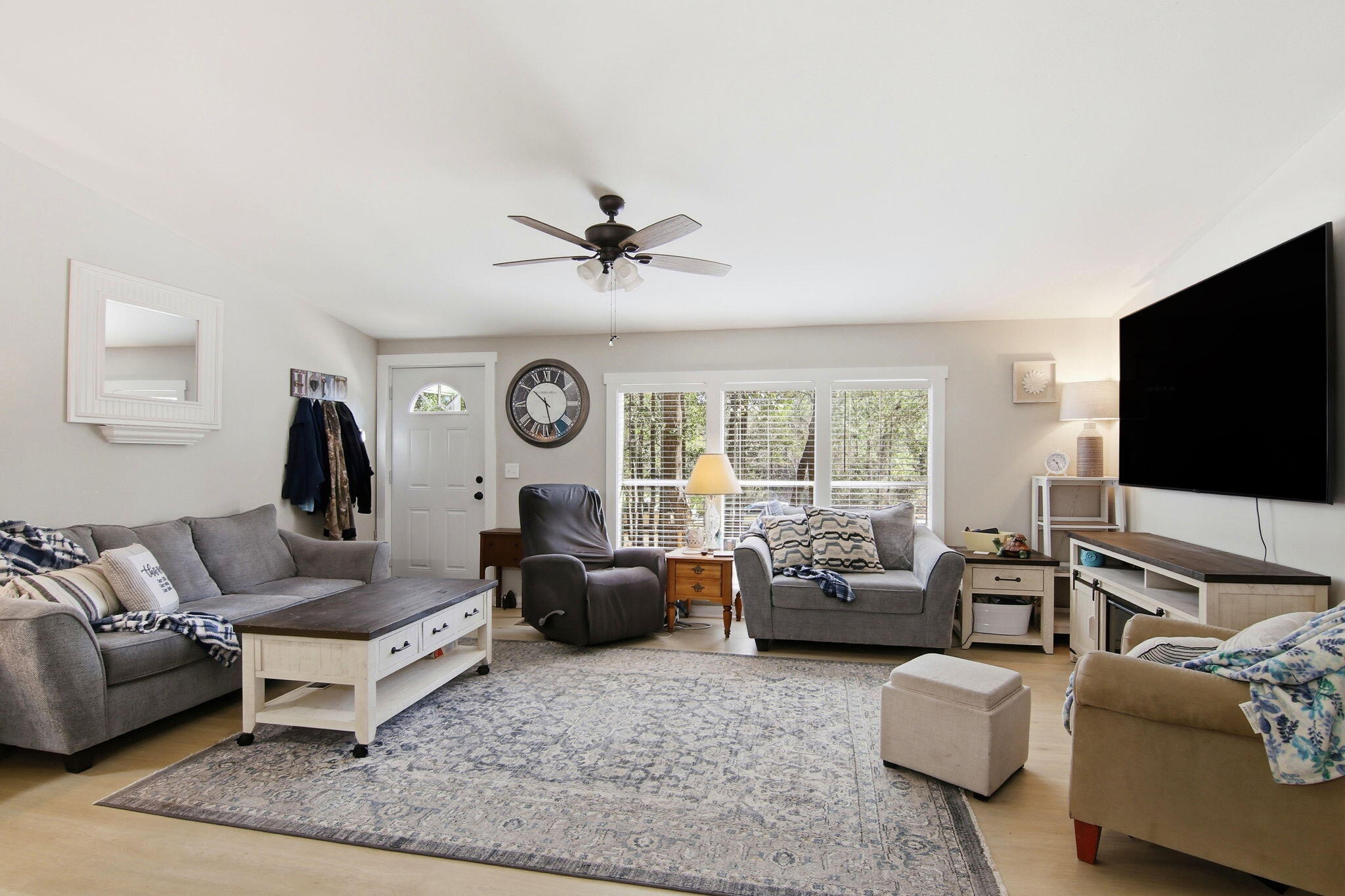 6108 Old River Road Baker, FL 32531 - Photo 12 of 40 a living room with furniture and a flat screen tv