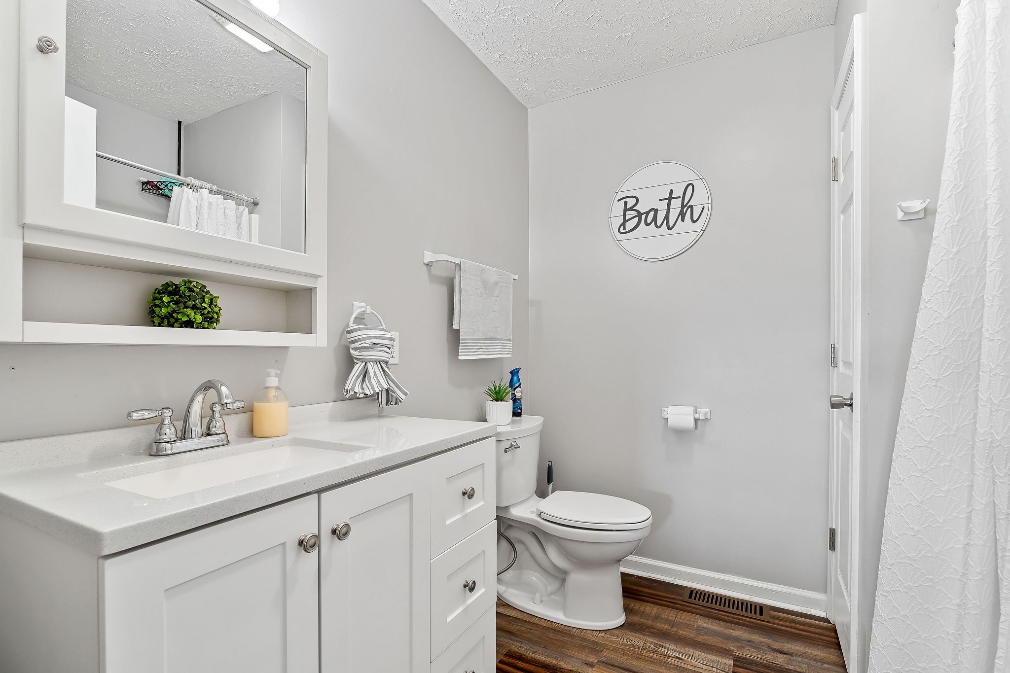 249 Darlene Drive Sparta, TN 38583 - Photo 13 of 21 a bathroom with a sink a toilet and a mirror