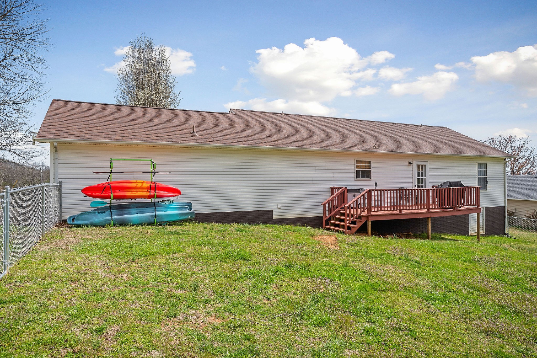249 Darlene Drive Sparta, TN 38583 - Photo 20 of 21 a backyard of a house with table and chairs