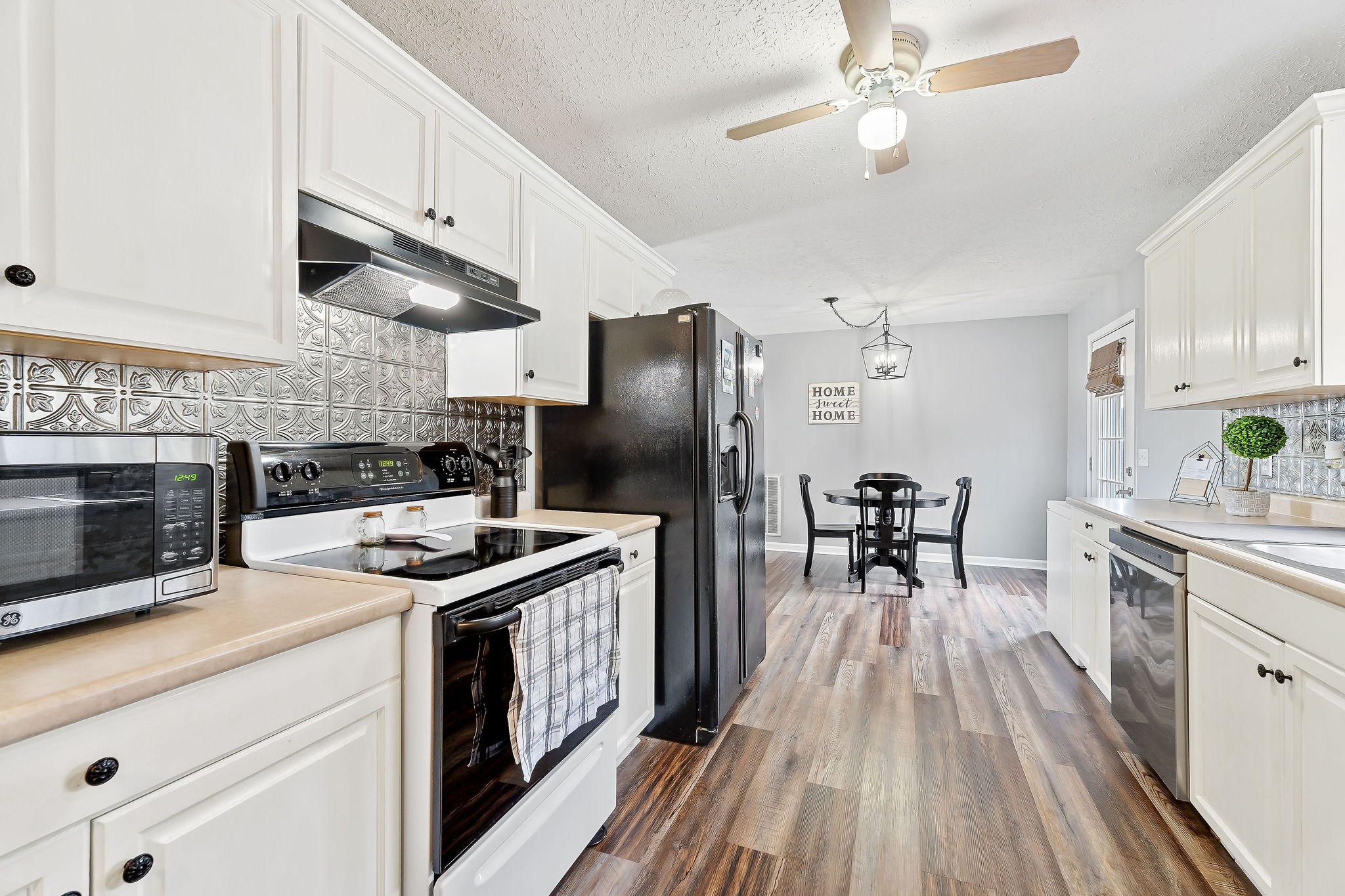 249 Darlene Drive Sparta, TN 38583 - Photo 6 of 21 a kitchen with a stove refrigerator and microwave