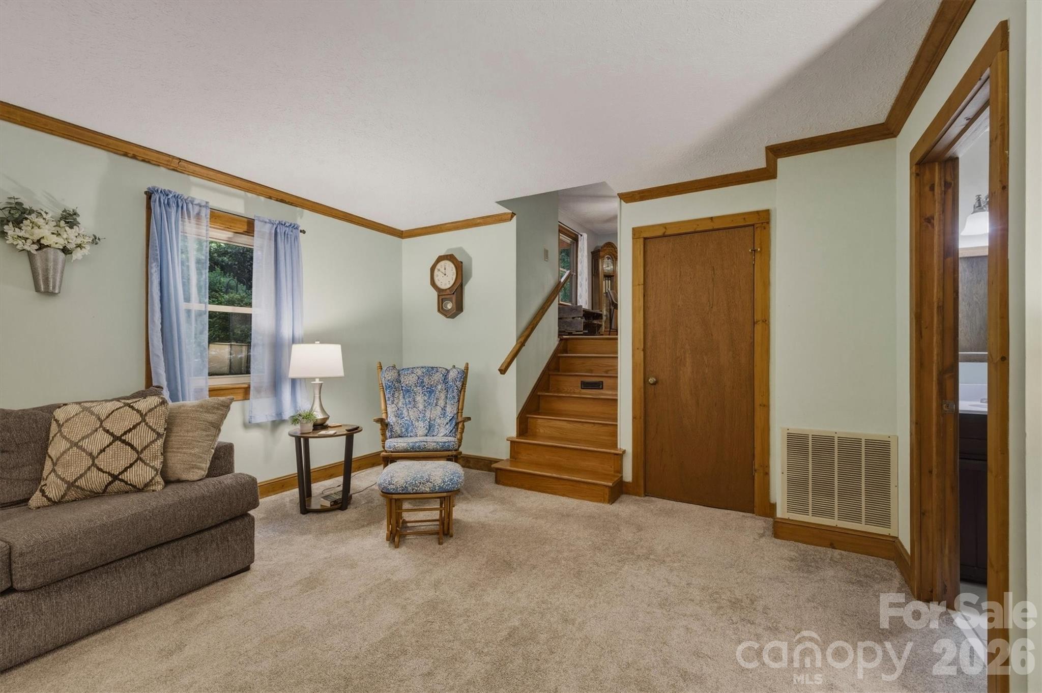 3432 Ridgewood Drive Morganton, NC 28655 - Photo 13 of 36 a living room with furniture and stairs