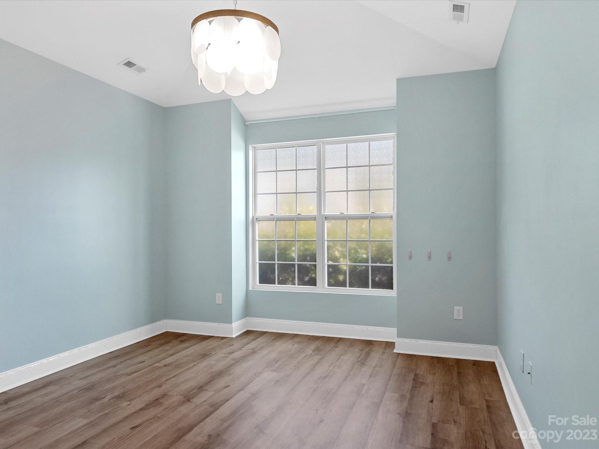 78005 Rillstone Drive Lancaster, SC 29720 - Photo 12 of 41 wooden floor in an empty room with a window