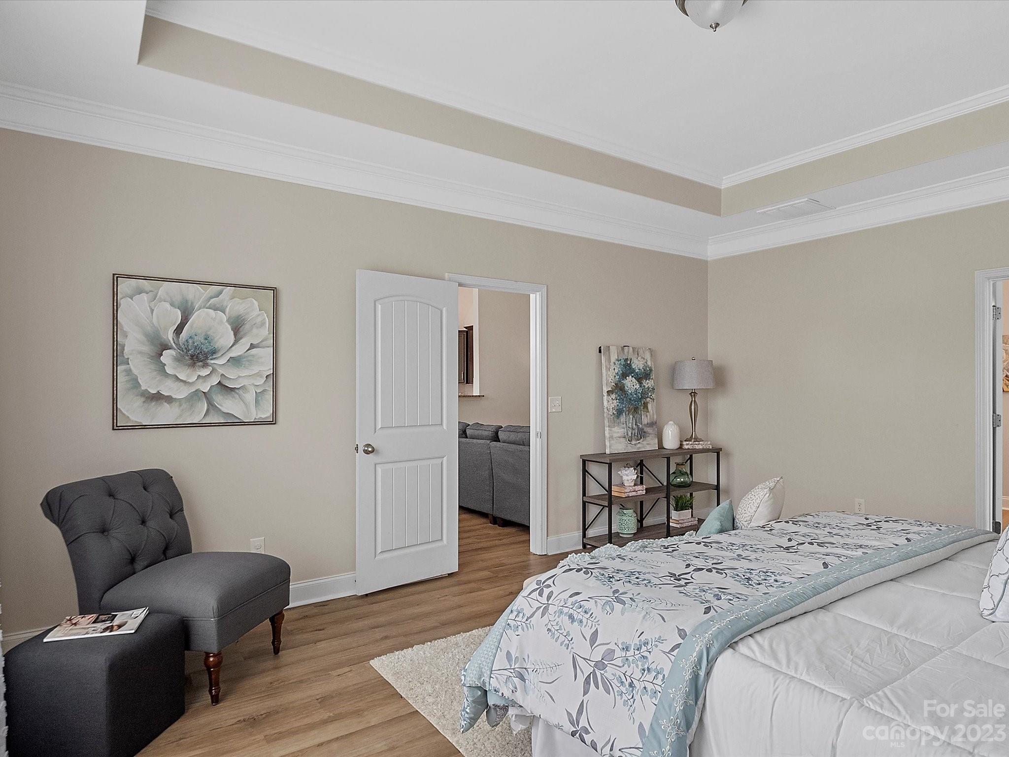 78005 Rillstone Drive Lancaster, SC 29720 - Photo 17 of 41 a bedroom with bed furniture and wooden floor