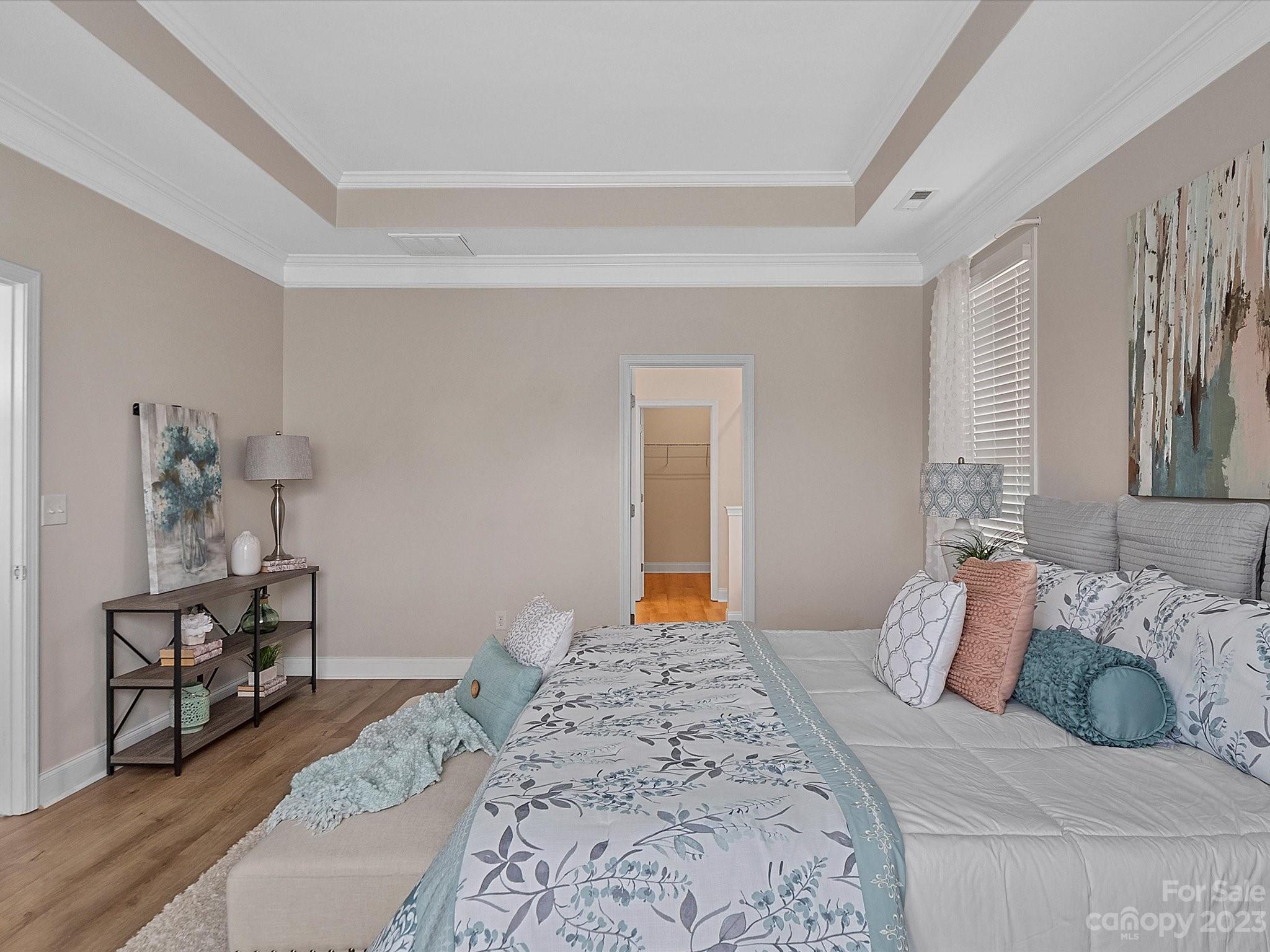 78005 Rillstone Drive Lancaster, SC 29720 - Photo 18 of 41 a bedroom with a bed and wooden floor
