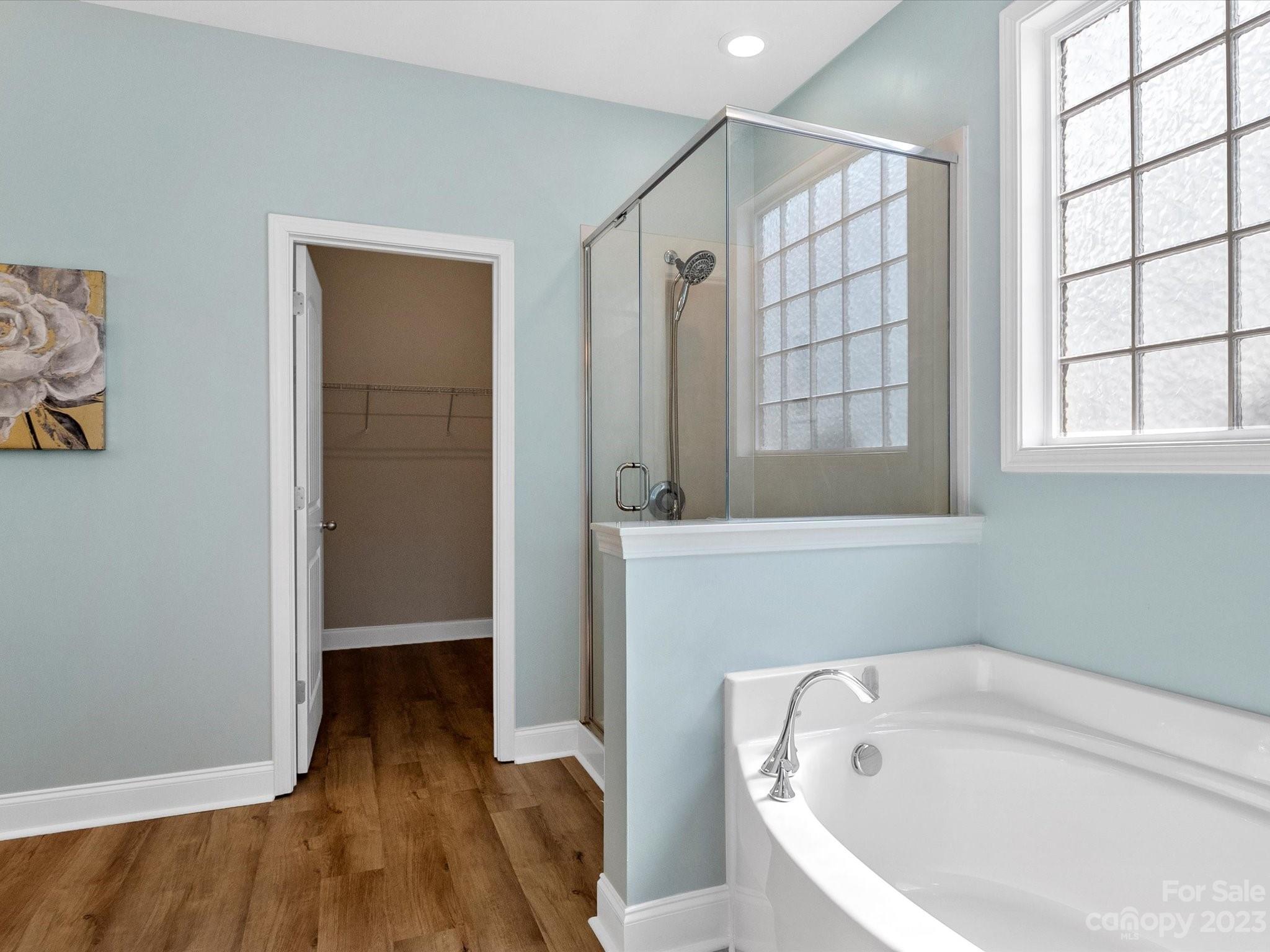 78005 Rillstone Drive Lancaster, SC 29720 - Photo 19 of 41 a bathroom with a tub shower and sink