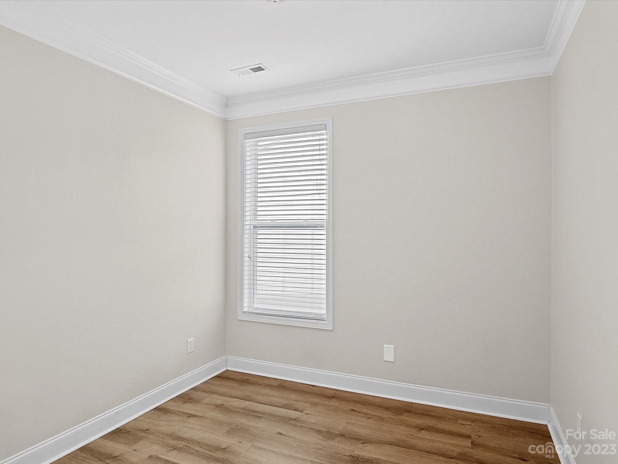 78005 Rillstone Drive Lancaster, SC 29720 - Photo 23 of 41 an empty room with wooden floor and windows