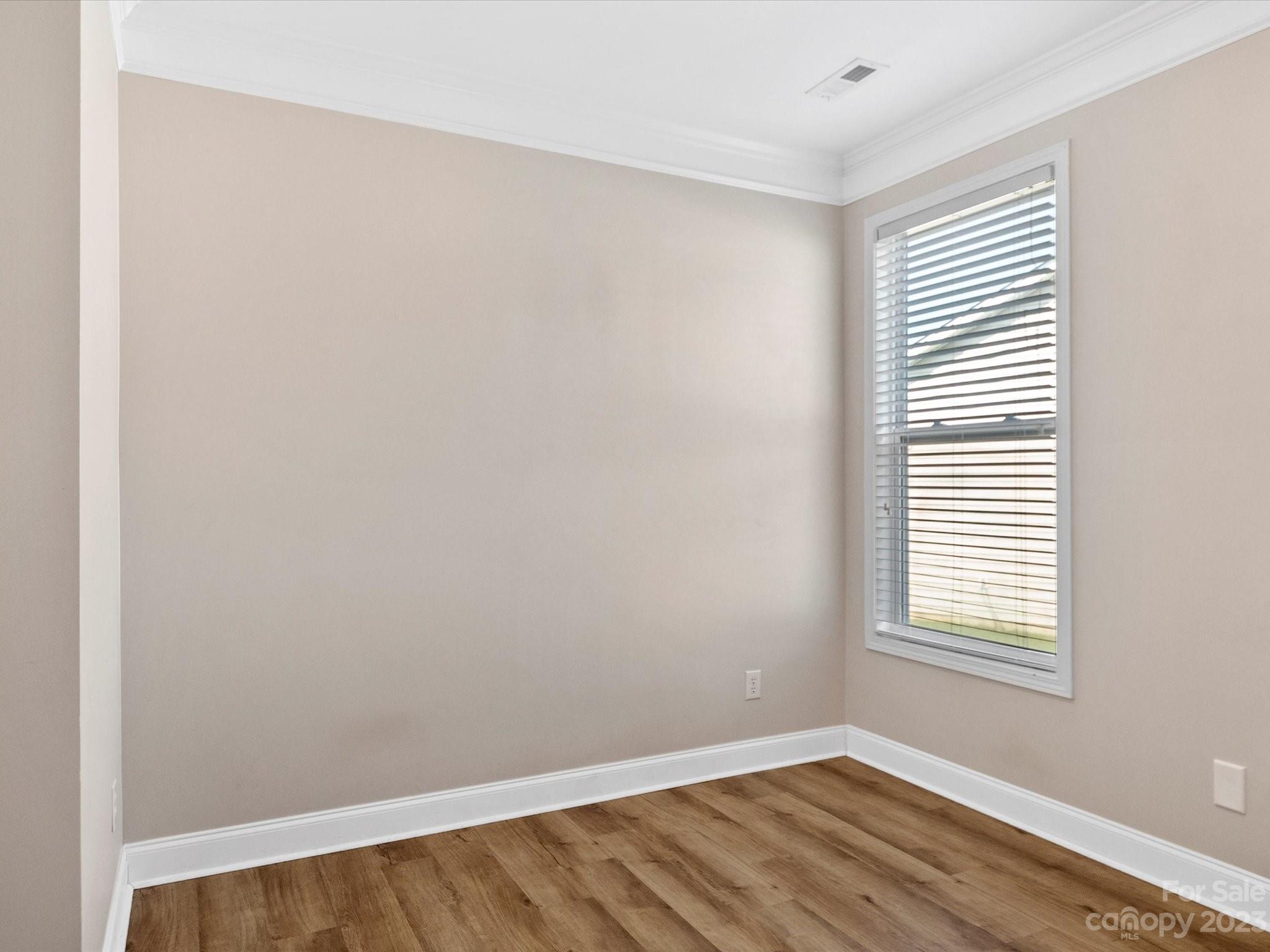 78005 Rillstone Drive Lancaster, SC 29720 - Photo 24 of 41 an empty room with wooden floor and a window