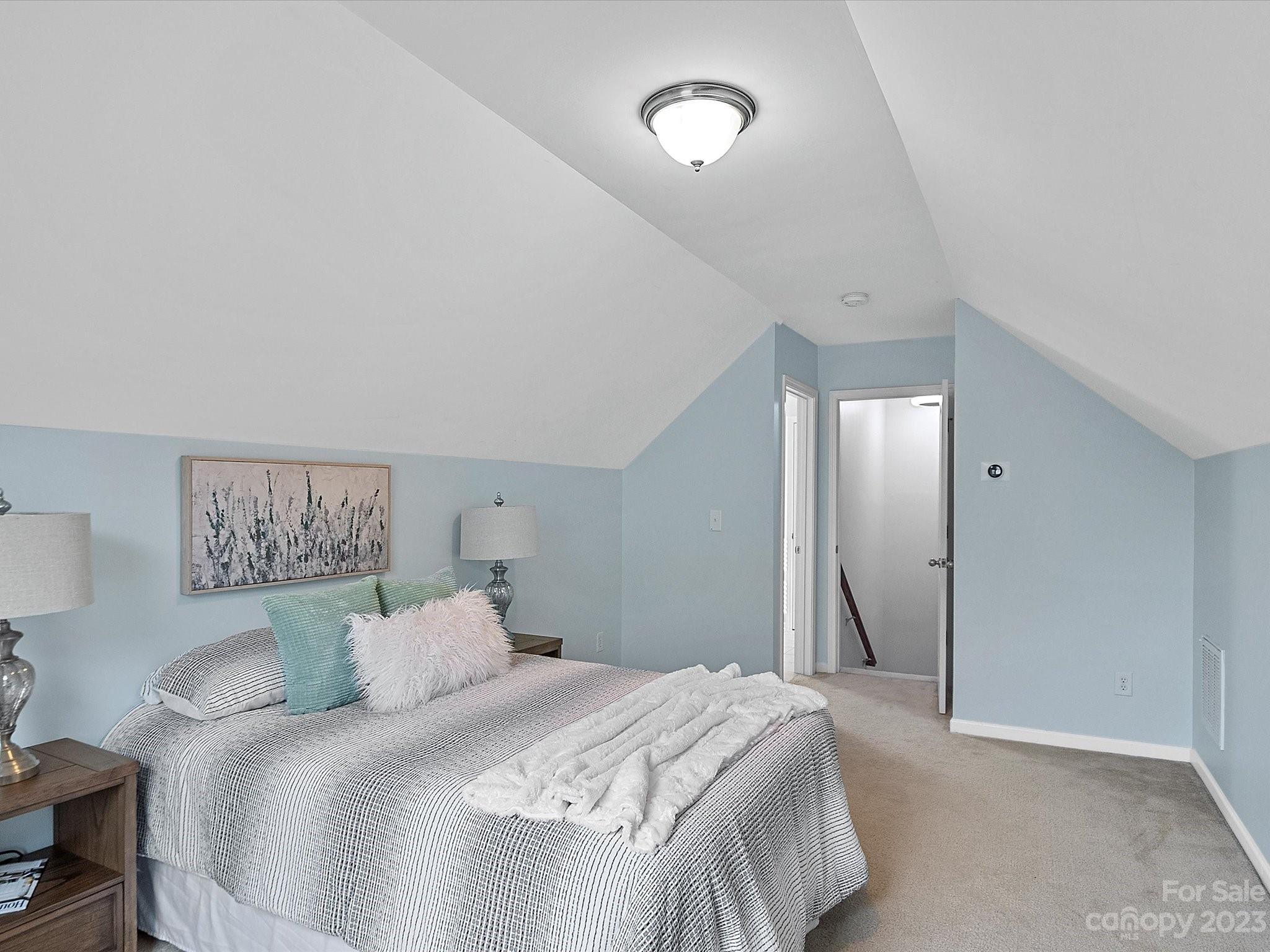 78005 Rillstone Drive Lancaster, SC 29720 - Photo 27 of 41 a bedroom with a bed and a painting on the wall