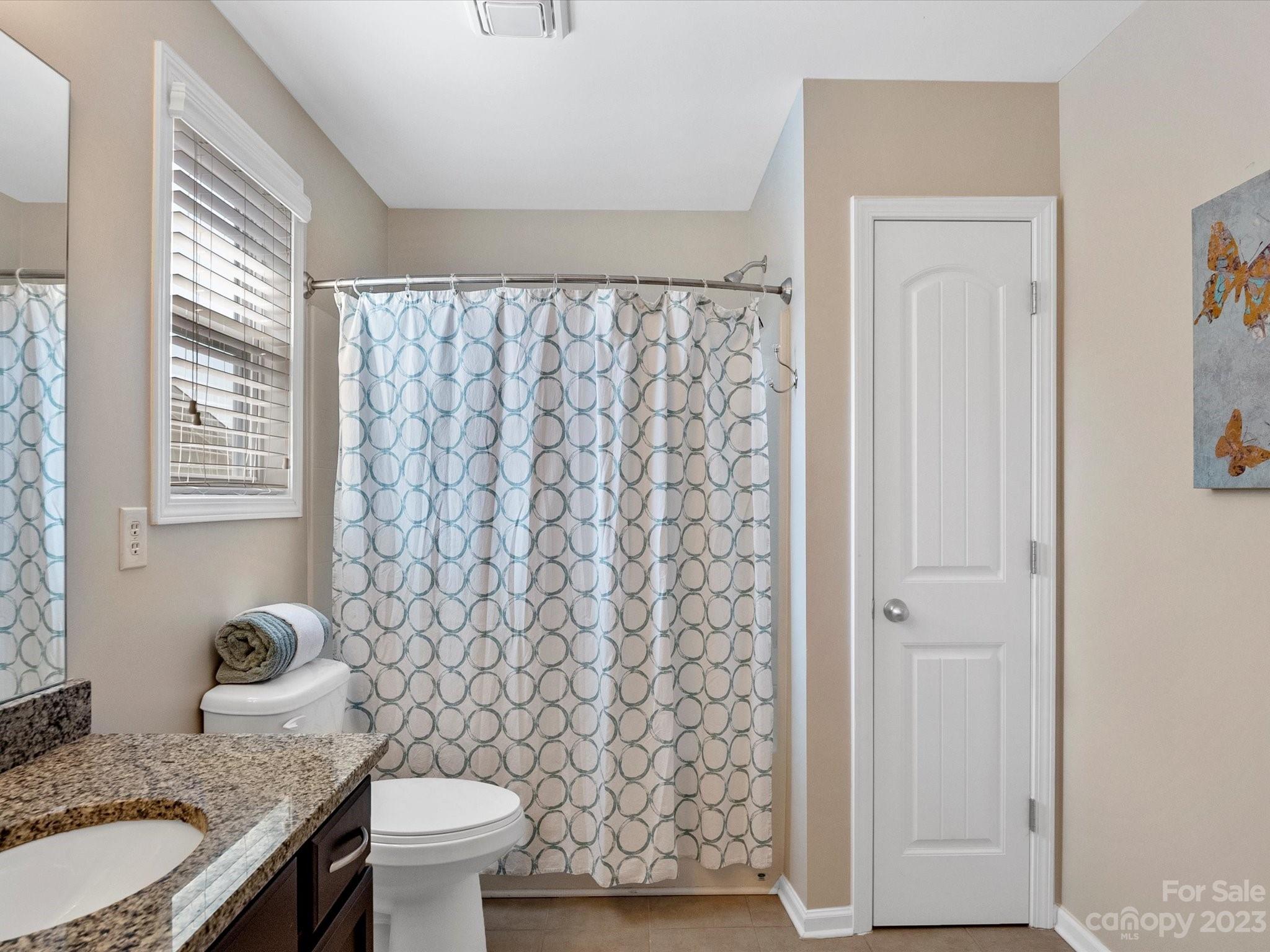 78005 Rillstone Drive Lancaster, SC 29720 - Photo 29 of 41 a bathroom with a granite countertop sink and a mirror