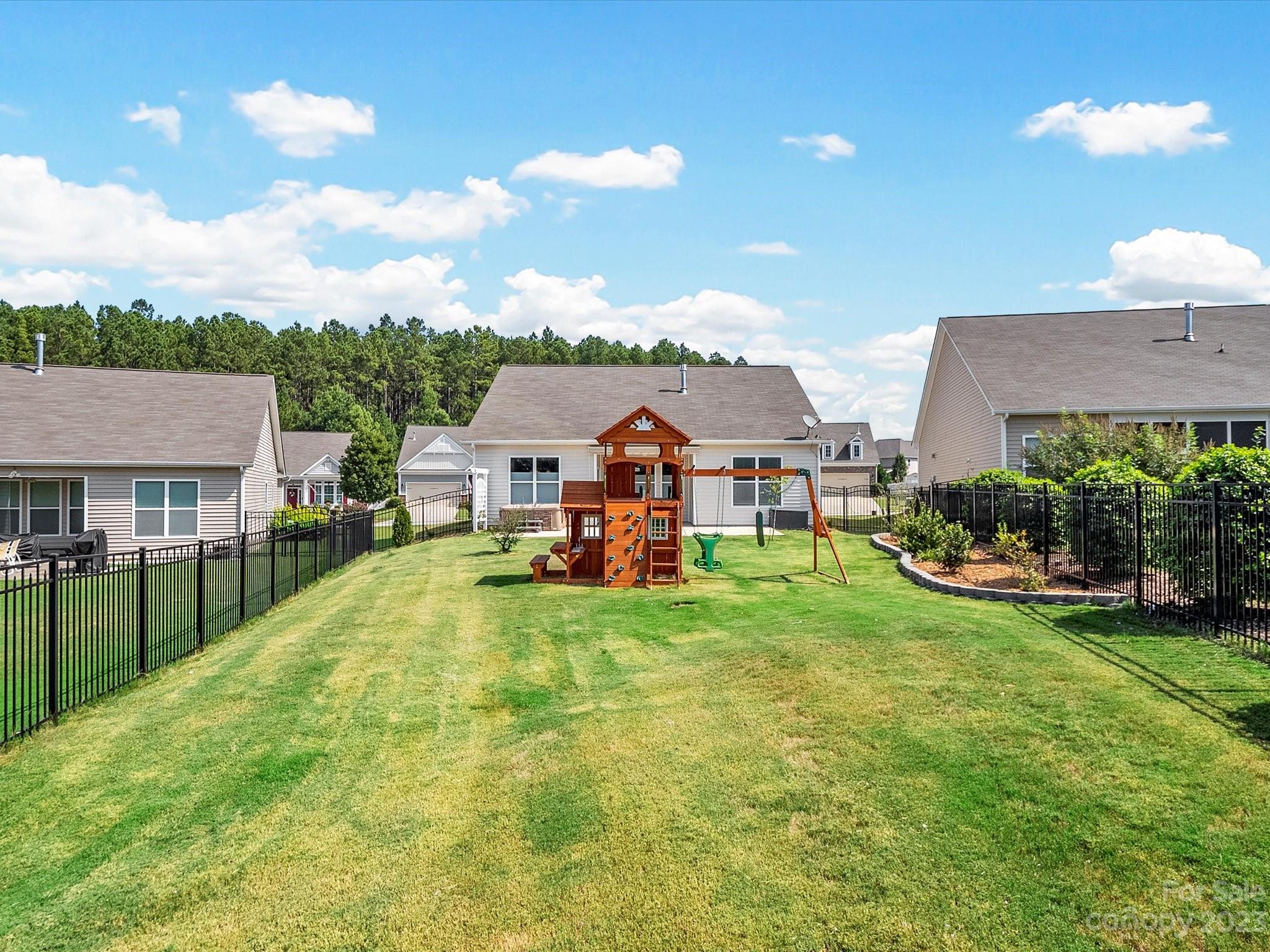 78005 Rillstone Drive Lancaster, SC 29720 - Photo 34 of 41 a view of a house with a big yard and potted plants