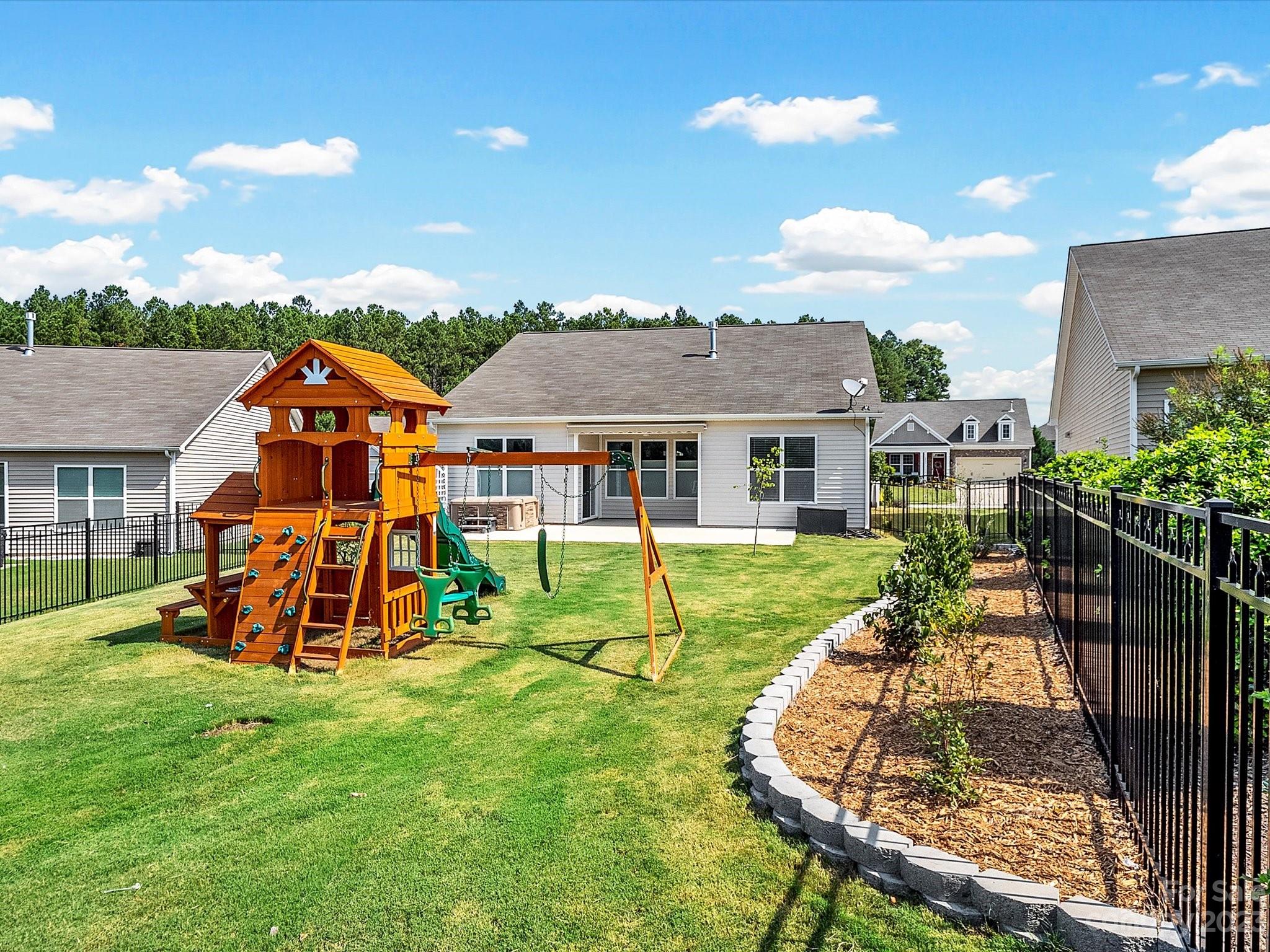 78005 Rillstone Drive Lancaster, SC 29720 - Photo 36 of 41 front view of a house with a yard