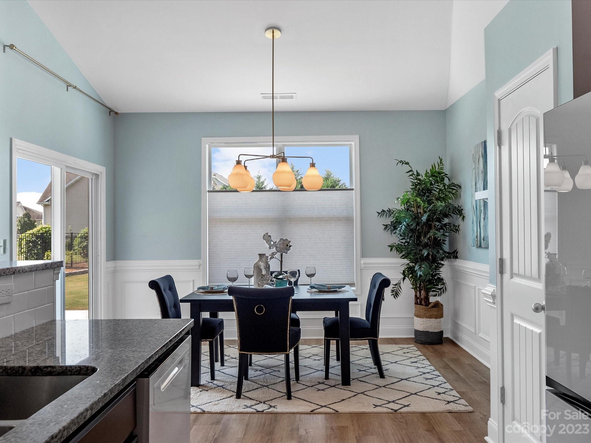 78005 Rillstone Drive Lancaster, SC 29720 - Photo 9 of 41 a view of a dining room with furniture window and wooden floor