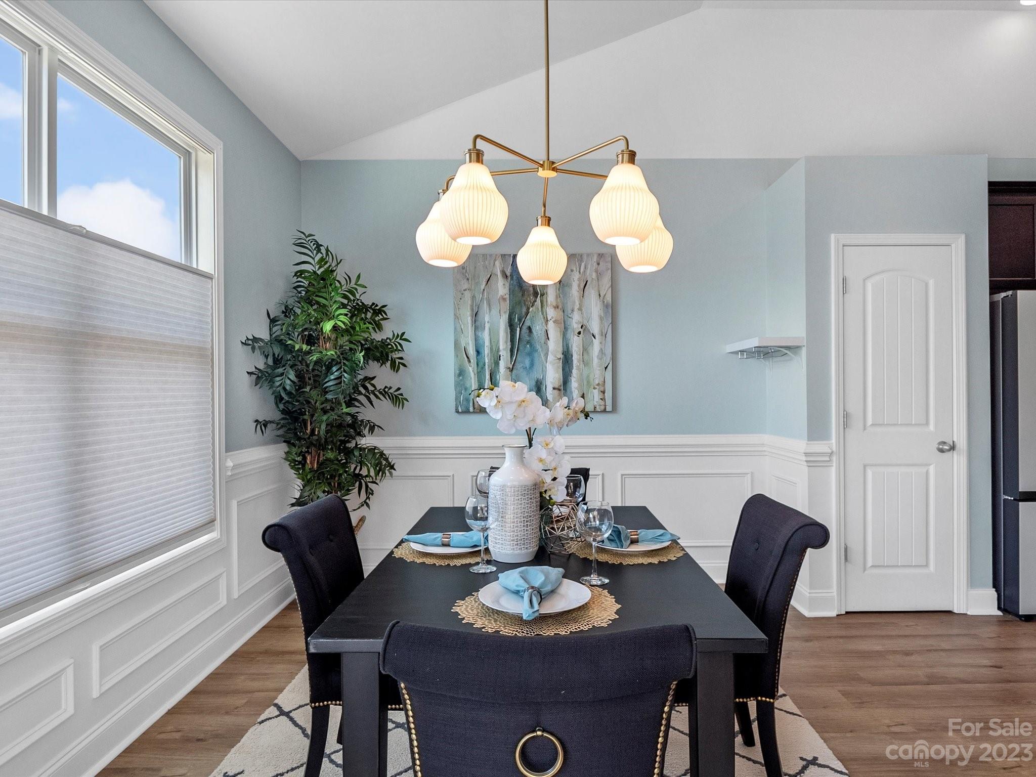 78005 Rillstone Drive Lancaster, SC 29720 - Photo 10 of 41 a dining room with furniture and wooden floor