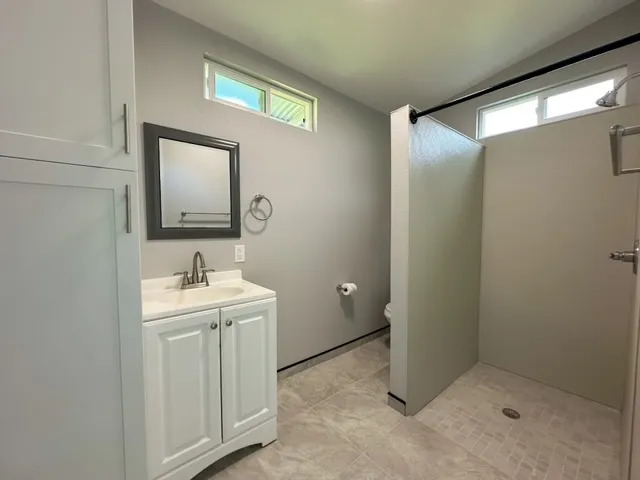 a bathroom with a sink and mirror