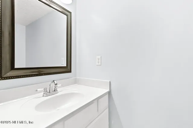a kitchen with cabinets a sink and appliances