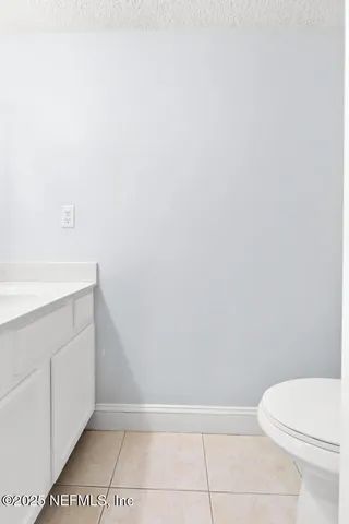 a stove top oven sitting inside of a kitchen