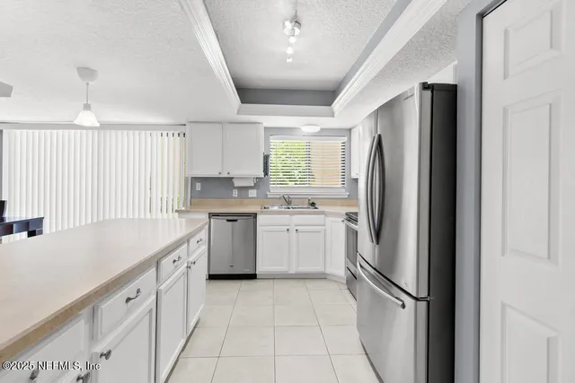 a view of a workspace with furniture