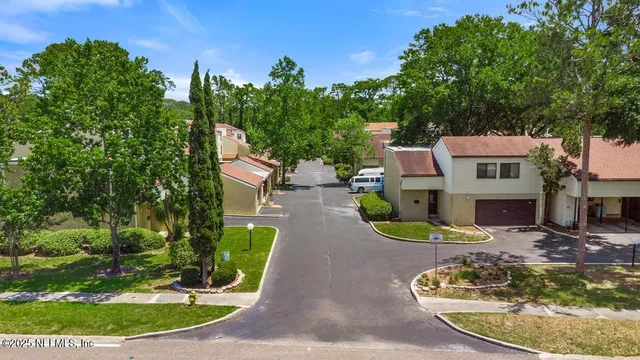 a view of a water fountain in front of a house