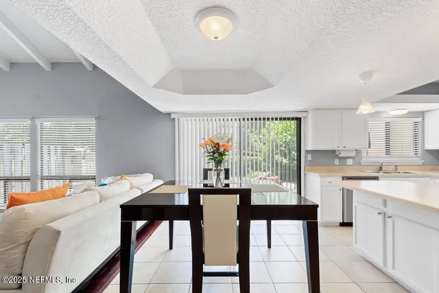 a bedroom with a bed and a table