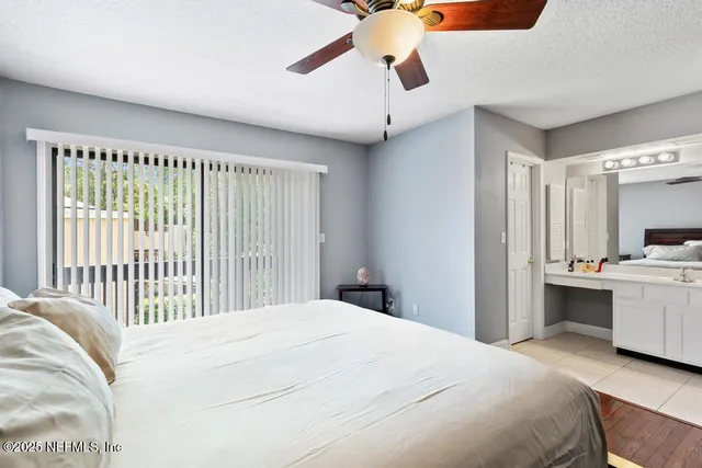 a view of a tree in front of a house