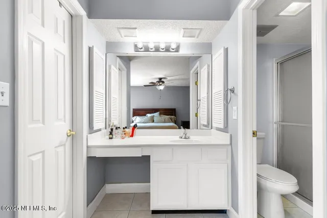 a view of a lake with houses in back