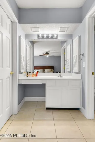 a view of a lake with houses in the background