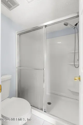 a view of a lake with houses in the back