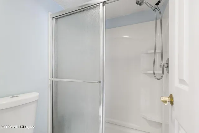 a view of a lake with houses in the back