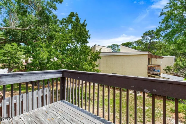 a view of a lake with houses in the back
