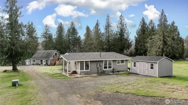 a house with trees in the background