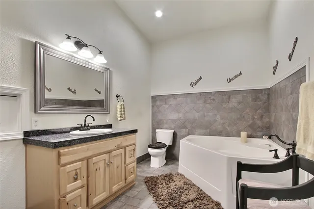 a bathroom with a sink double vanity and a mirror