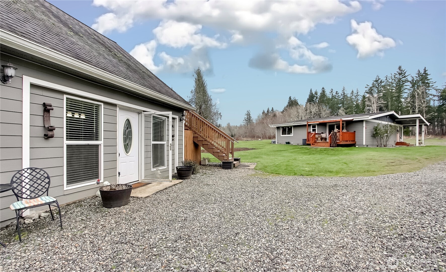 149 Barton Road Rochester, WA 98579 - Photo 19 of 36 a view of a house with backyard and sitting area