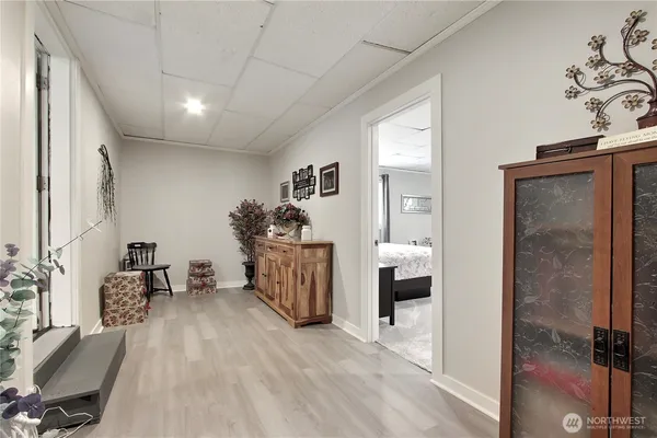 a spacious bedroom with a bed and a cabinets