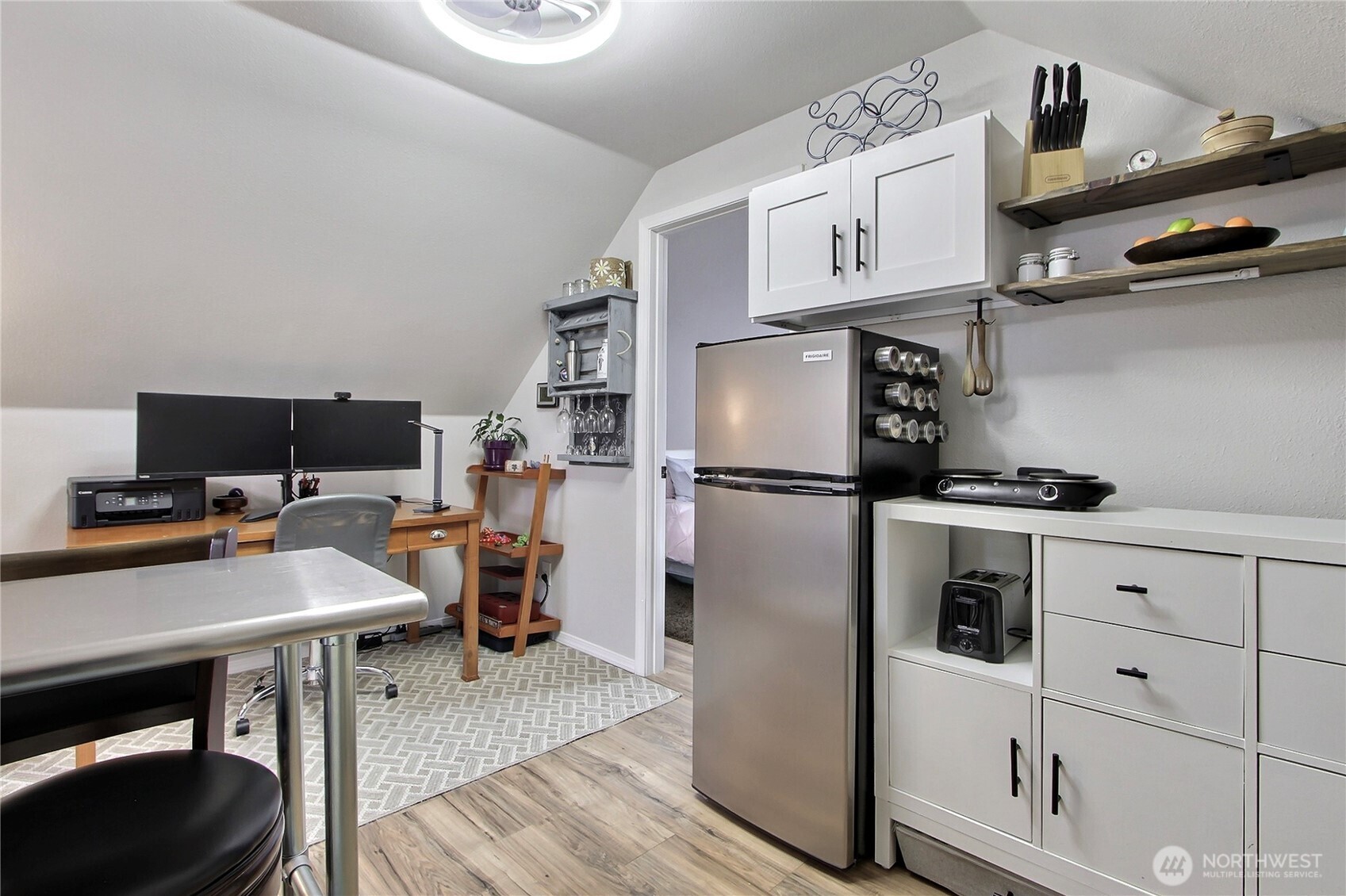 149 Barton Road Rochester, WA 98579 - Photo 34 of 36 a kitchen with cabinets and wooden floor
