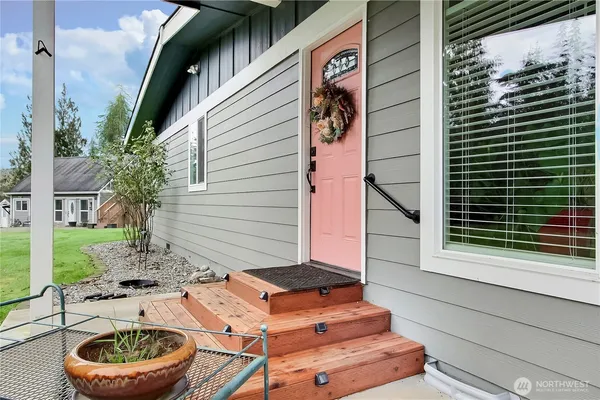 a backyard of a house with outdoor seating