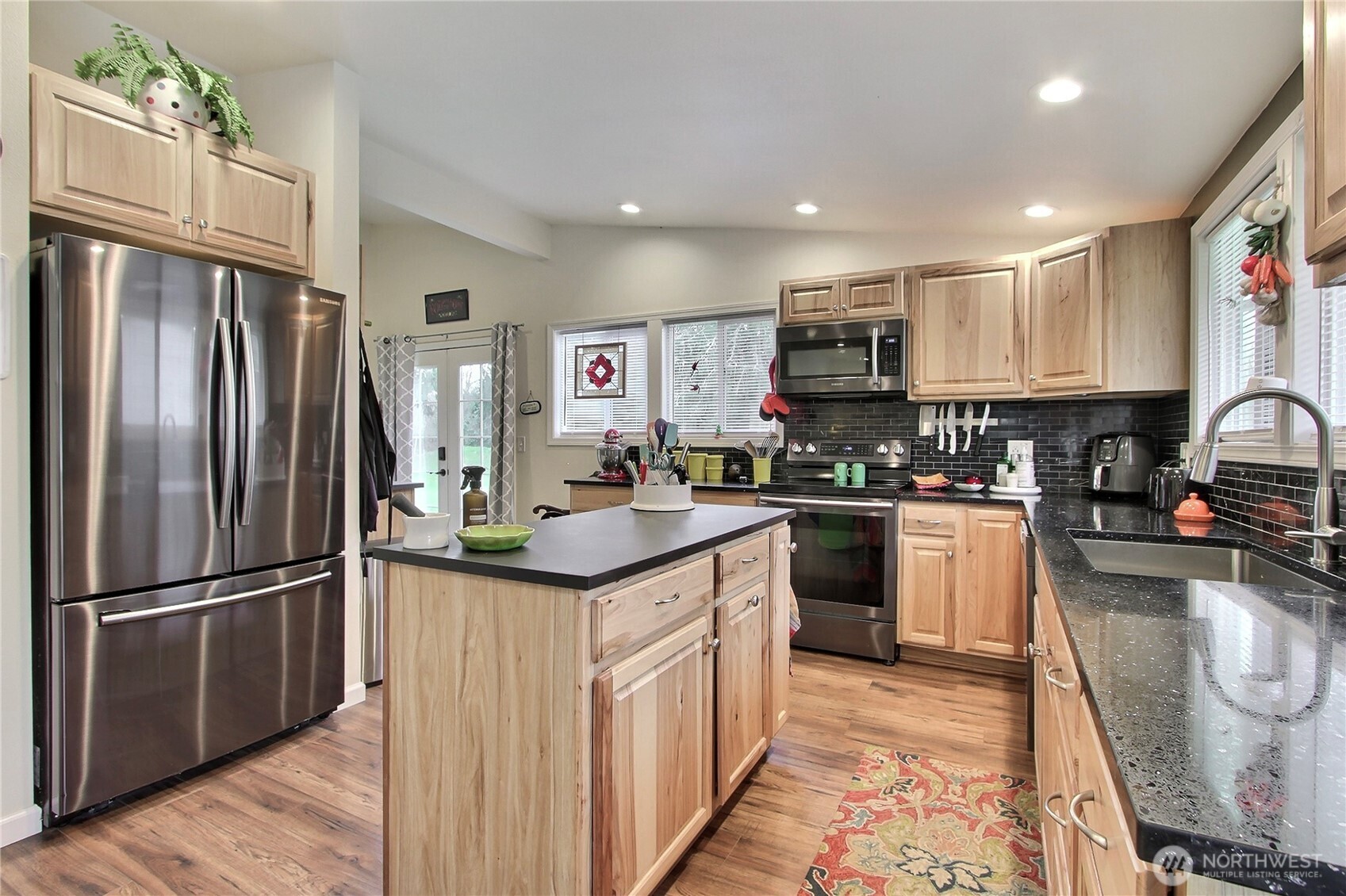 149 Barton Road Rochester, WA 98579 - Photo 7 of 36 a kitchen with stainless steel appliances granite countertop a refrigerator and a stove top oven
