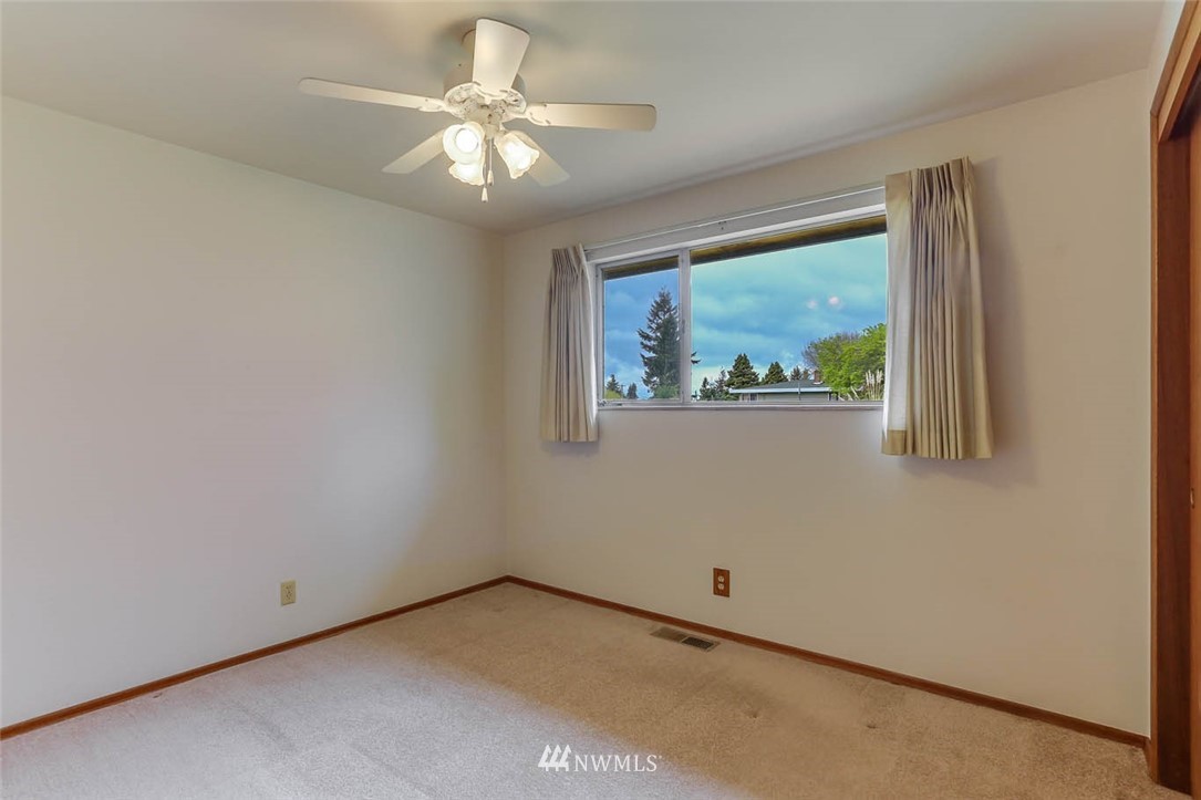 11222 Southeast 182nd Street Renton, WA 98055 - Photo 16 of 24 an empty room with a window