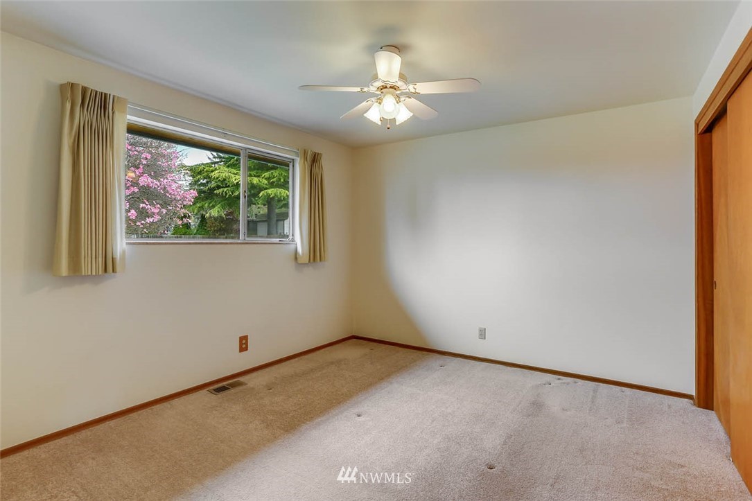 11222 Southeast 182nd Street Renton, WA 98055 - Photo 19 of 24 an empty room with a window