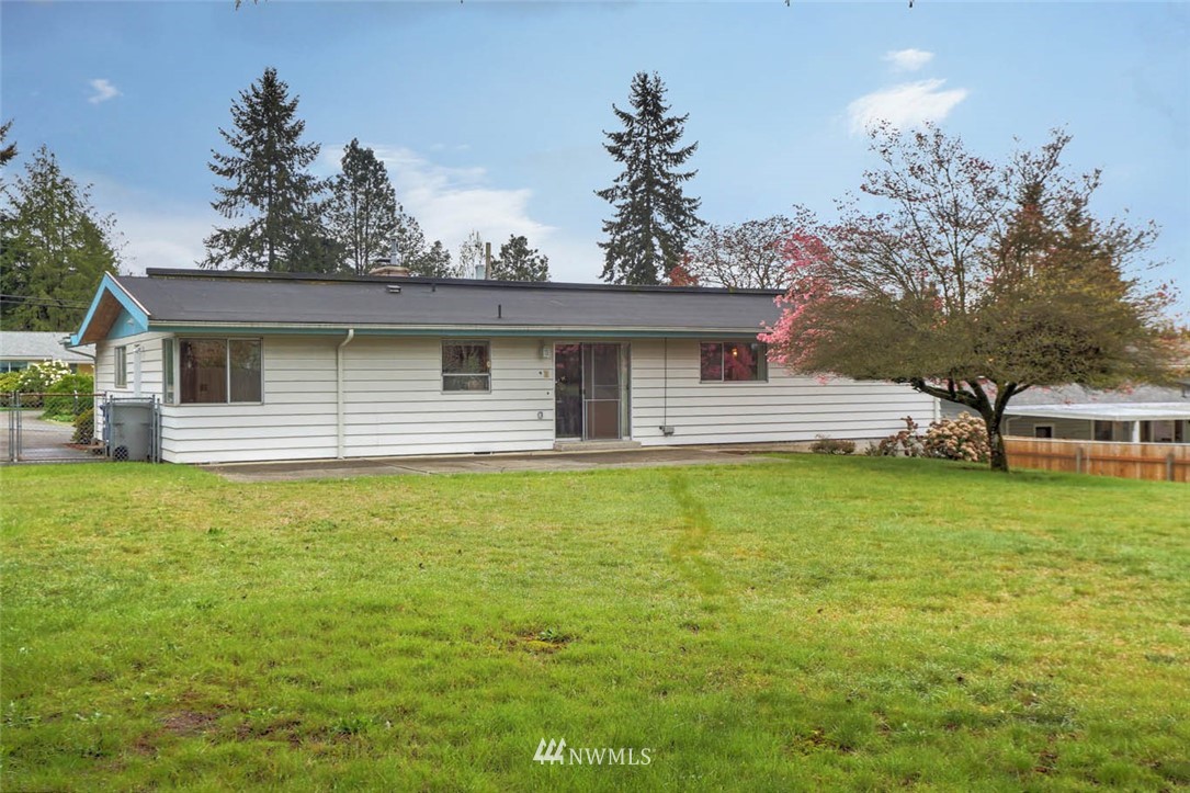 11222 Southeast 182nd Street Renton, WA 98055 - Photo 22 of 24 a front view of a house with garden