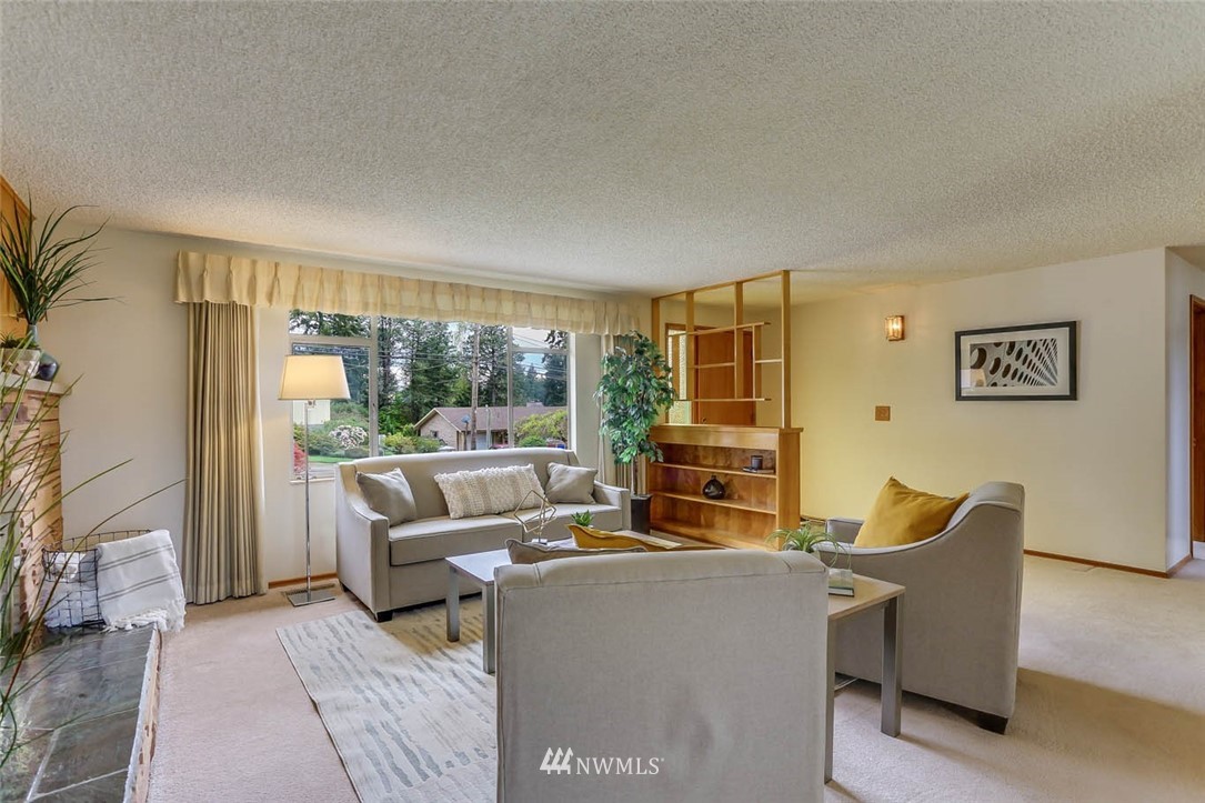 11222 Southeast 182nd Street Renton, WA 98055 - Photo 5 of 24 a living room with furniture and a large window