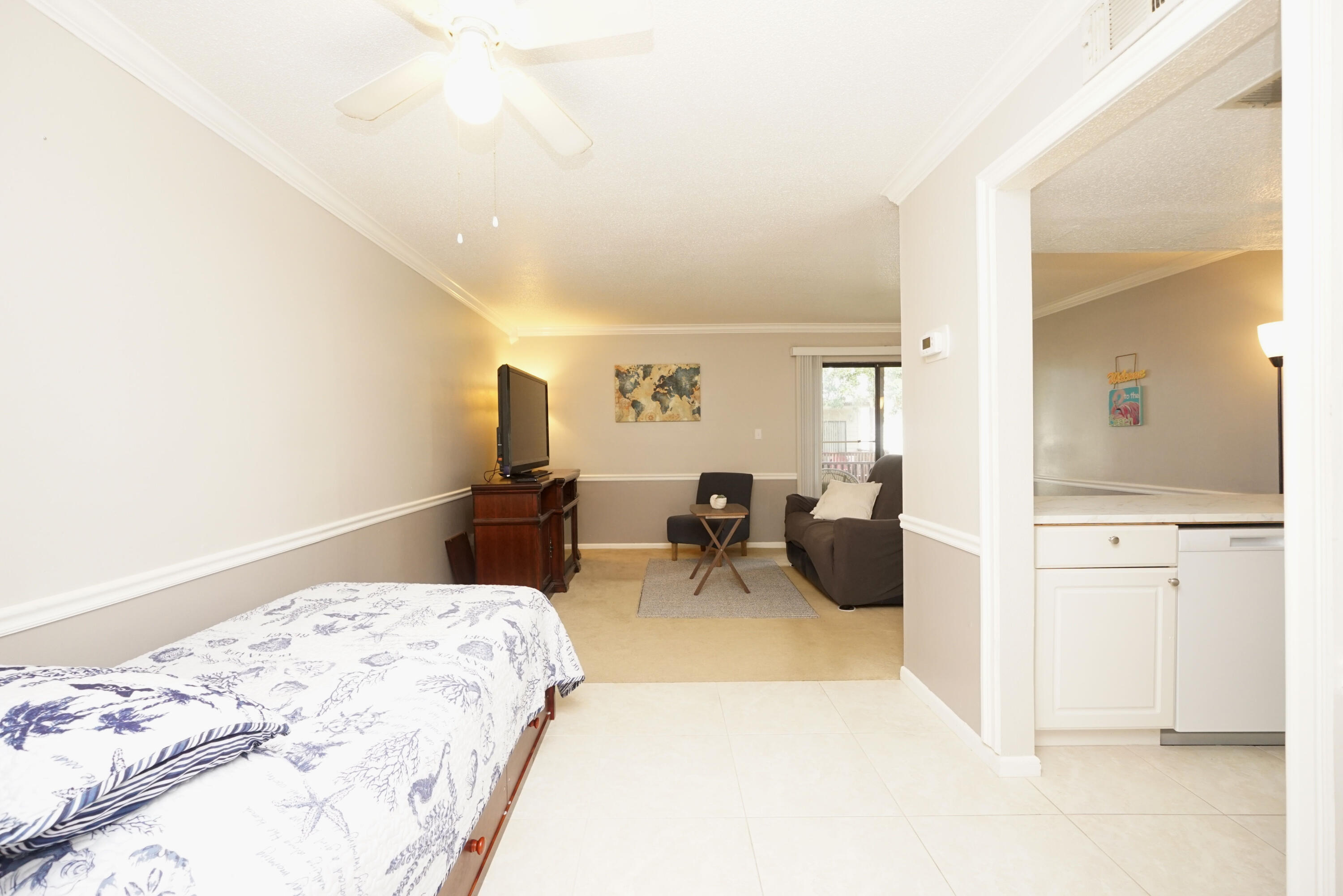 308 Miracle Strip Parkway Southwest, Unit 7D Fort Walton Beach, FL 32548 - Photo 21 of 34 a bedroom with a bed and furniture