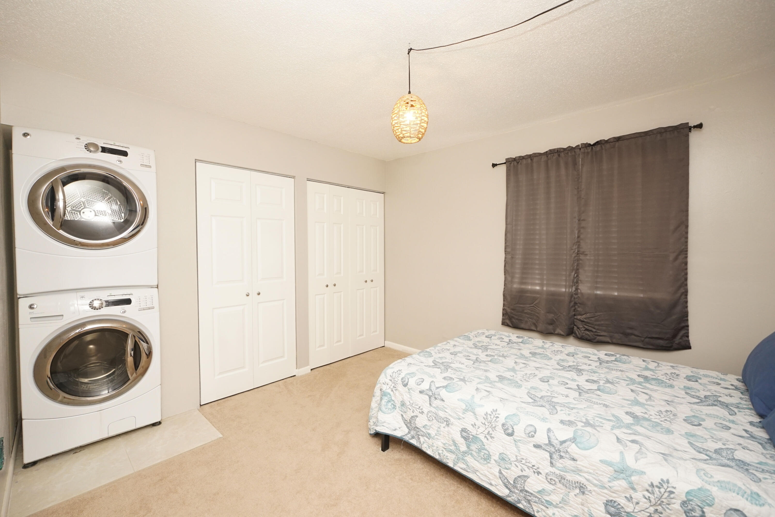 308 Miracle Strip Parkway Southwest, Unit 7D Fort Walton Beach, FL 32548 - Photo 24 of 34 a bedroom with a bed and a window