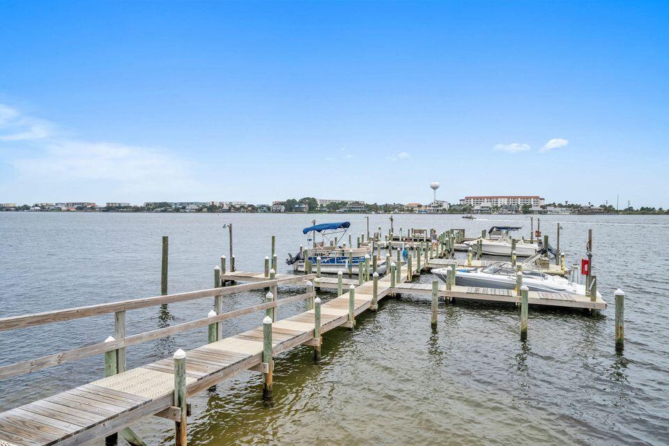 308 Miracle Strip Parkway Southwest, Unit 7D Fort Walton Beach, FL 32548 - Photo 27 of 34 a view of a lake with couches chairs