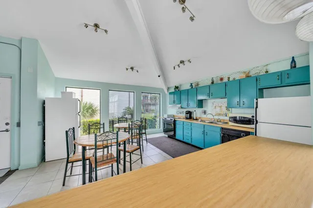 a kitchen with sink cabinets and wooden floor
