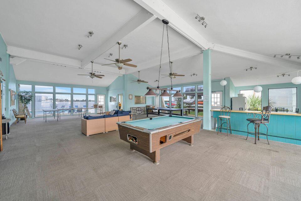 308 Miracle Strip Parkway Southwest, Unit 7D Fort Walton Beach, FL 32548 - Photo 33 of 34 a room with furniture and a chandelier