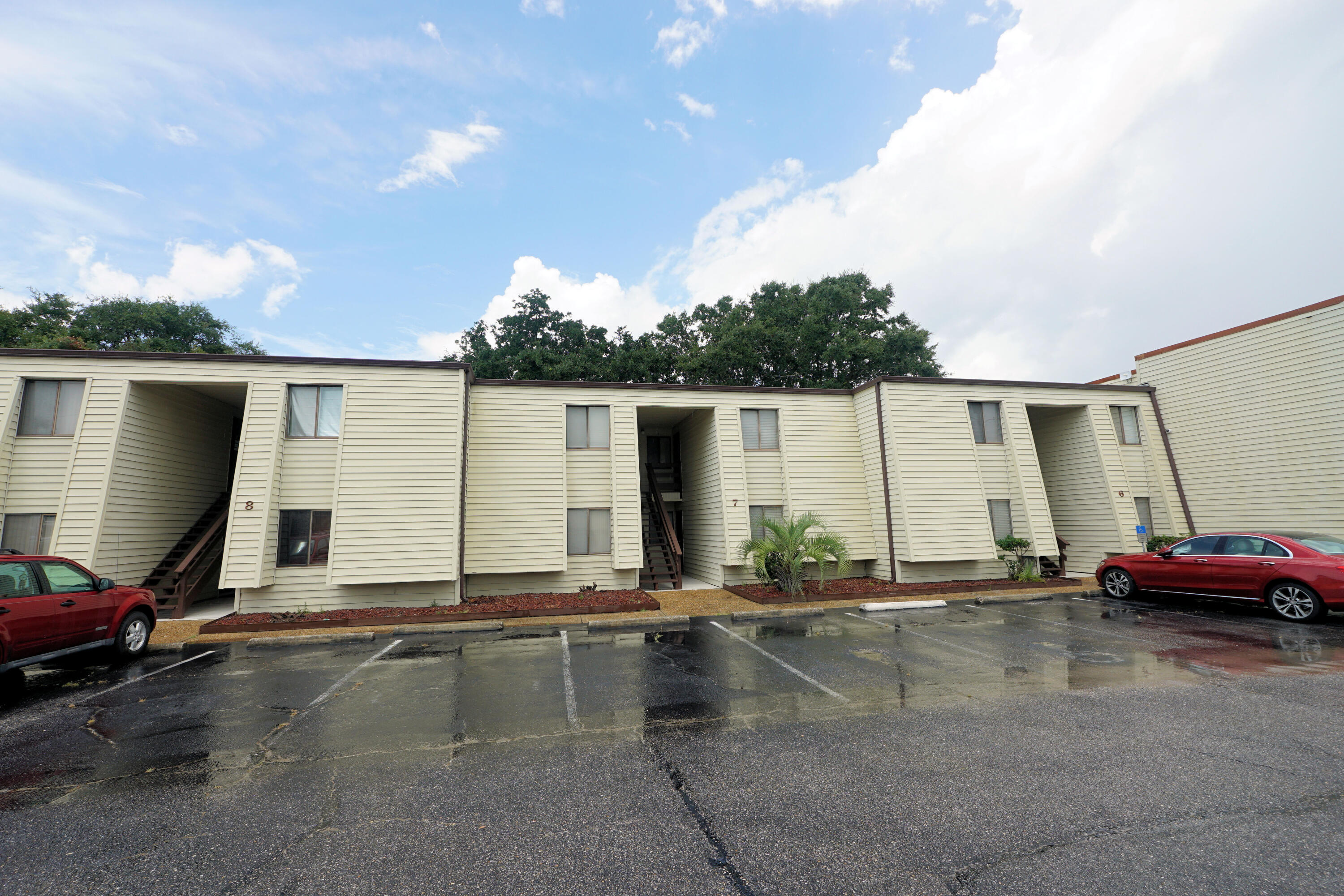 308 Miracle Strip Parkway Southwest, Unit 7D Fort Walton Beach, FL 32548 - Photo 7 of 34 a view of a back yard of the house