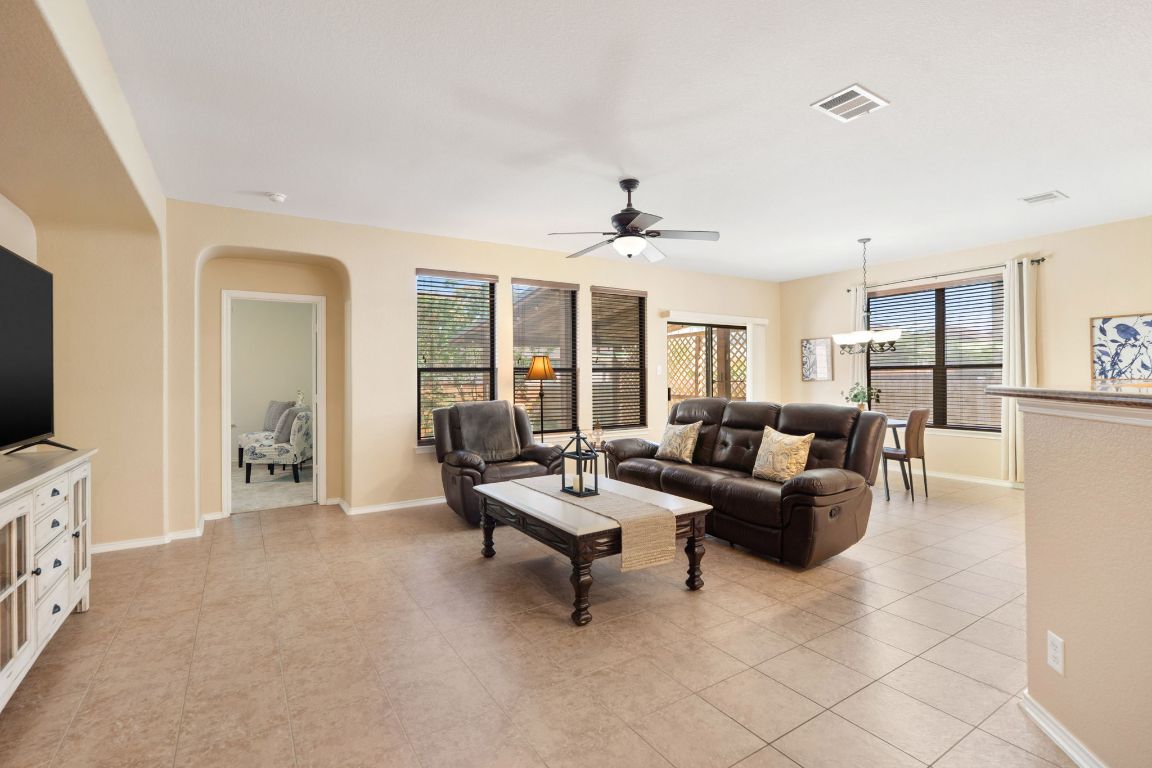 366 Matthews Lane Kyle, TX 78640 - Photo 12 of 25 a living room with furniture and a flat screen tv