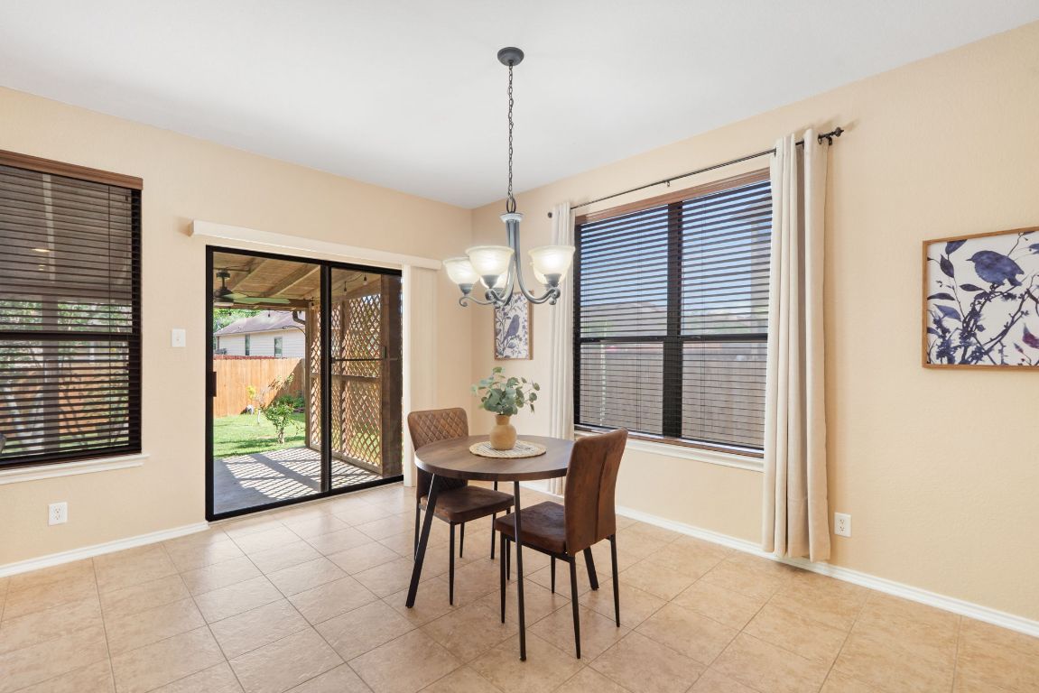 366 Matthews Lane Kyle, TX 78640 - Photo 13 of 25 a dining room with furniture and window